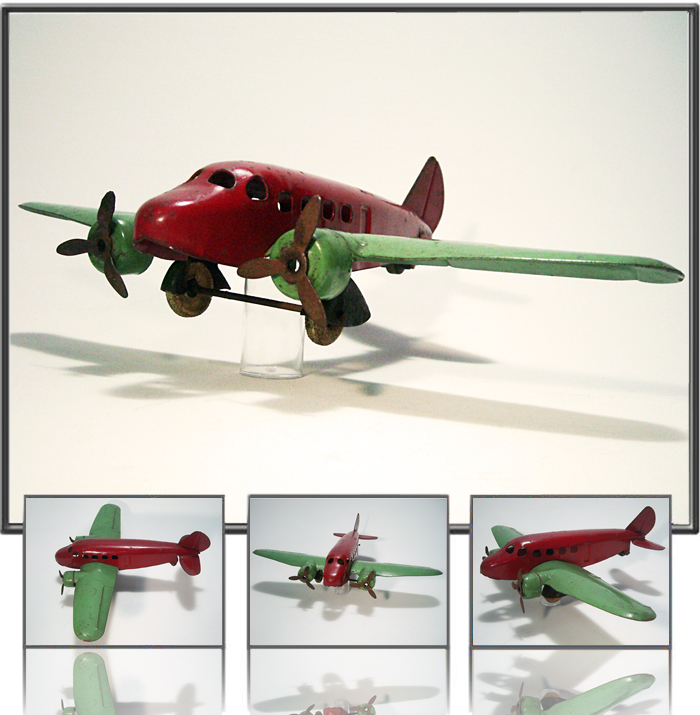 Antique Tin  Airplane Toy Pressed steel twin prop passenger airplane. Made by Wyandotte, USA, 1940th